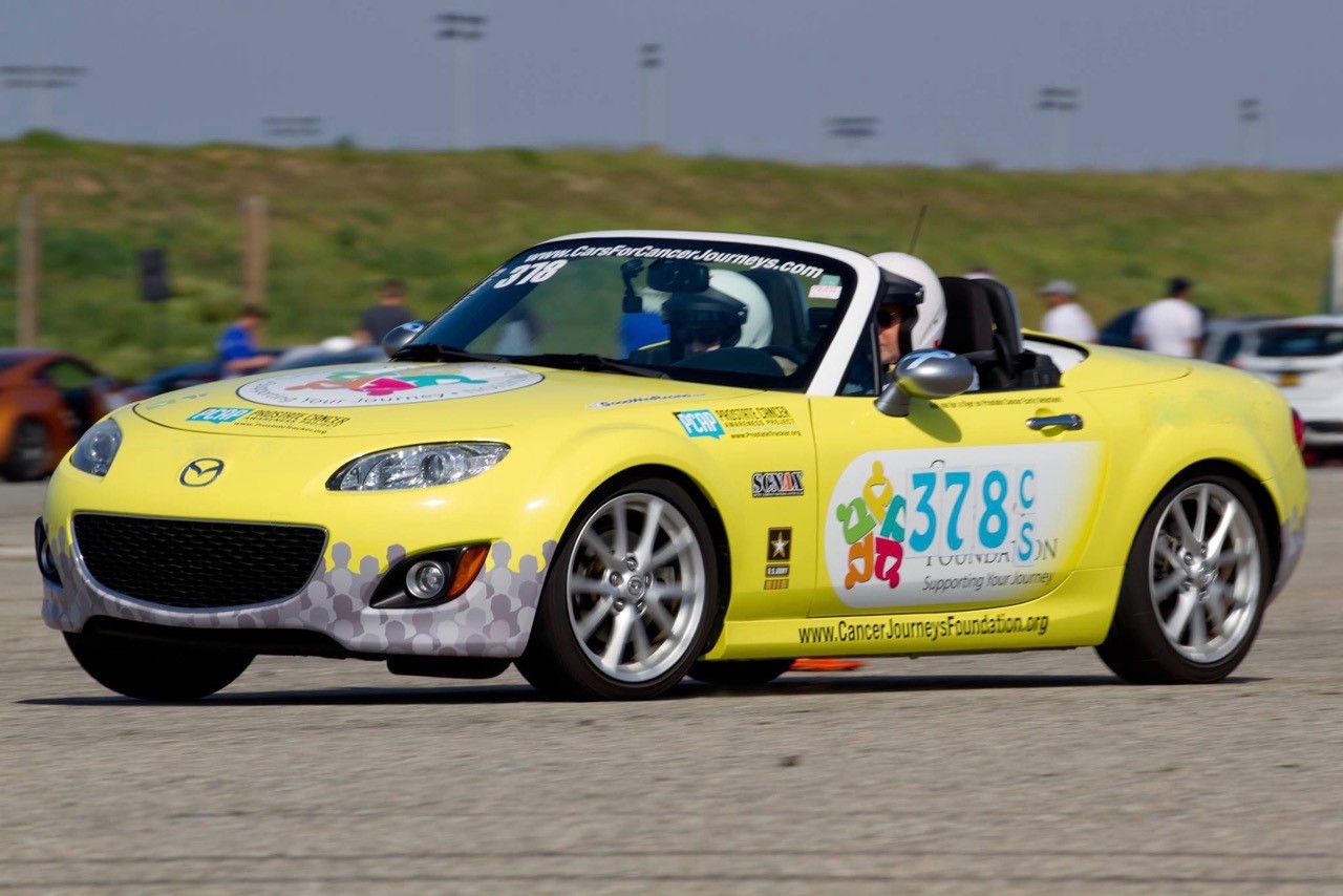 A Bright Yellow Miata Leads the Team Autocross Competition for Cancer